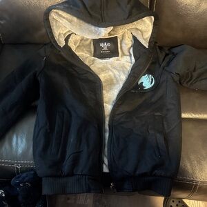 Ulu Black Kids Hoodie Jacket with Gray Sherpa Lining and Teal Emblem- Xiuluo